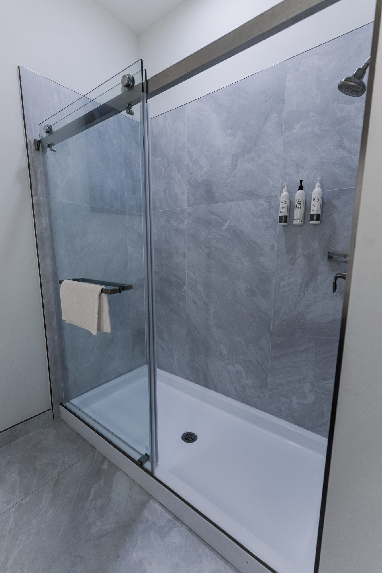 Double vanity bathroom with glass shower